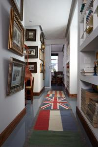 a hallway with a colorful rug on the floor at Nieuwehuyz in Prince Albert