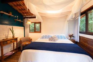 Cama ou camas em um quarto em Lilás Hospedagem e Terapias