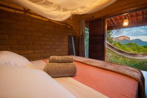 Cama ou camas em um quarto em Lilás Hospedagem e Terapias