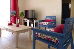 A television and/or entertainment centre at Villa in Nopigia with private pool