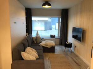 Uma área de estar em Cozy apartment in Ostend