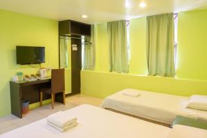 เตียงในห้องที่ Uptown Hotel Kajang