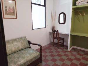 a living room with a couch and a chair at Casa Sarmiento in San Francisco del Monte de Oro