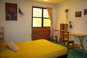 Postel nebo postele na pokoji v ubytování Casa Huipil