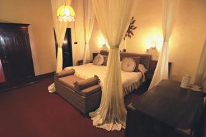 Postel nebo postele na pokoji v ubytování Bandarawela Hotel