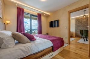 Postel nebo postele na pokoji v ubytování Apartman 65 Zlatibor