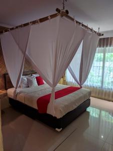 Tempat tidur dalam kamar di Kali Catur Resort