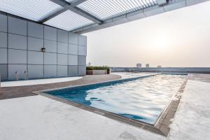 a swimming pool on the roof of a building at Live wondering timeless Mangroves of RAK in Ras al Khaimah