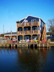 a large house on a dock on the water at The Inn at Fisherman's cove in Halifax