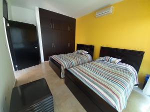 Un pat sau paturi într-o cameră la Apartamento en Playa Blanca - PANAMÁ