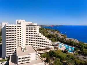 a large hotel with a view of the ocean at Özkaymak Falez Hotel in Antalya