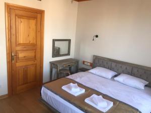 A bed or beds in a room at Green Mansion