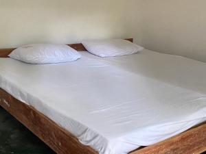 Postel nebo postele na pokoji v ubytování Jama’s Stay