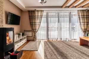Telewizja i/lub zestaw kina domowego w obiekcie ZAKOHOME- Z Widokiem Na Tatry Cieniówka