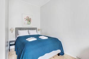 Postel nebo postele na pokoji v ubytování WeHost Modern Kitchen Studio with Bright Colours