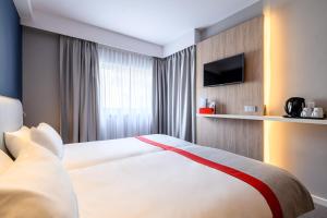 เตียงในห้องที่ Holiday Inn Express Mechelen City Centre, an IHG Hotel