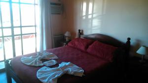Ліжко або ліжка в номері Apart Hotel Los Angelitos