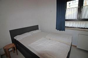 Łóżko lub łóżka w pokoju w obiekcie Haus Gerdi