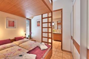 Un ou plusieurs lits dans un hébergement de l'établissement Appartements Haus Dr Muxel