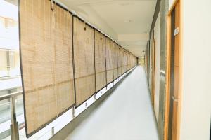 a hallway of lockers in a prison cell at Hotel Santeria Inn, Best Luxurious Hotel AC Rooms In Surat in Surat