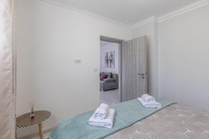 Ein Bett oder Betten in einem Zimmer der Unterkunft Royal Rose Gold Apartment