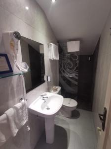 a bathroom with a sink and a toilet at Eco Hotel Mundaka in Mundaka