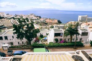 a view of a city and the ocean at Studio Jacaranda in Santiago del Teide