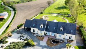 an aerial view of a house with a blue roof at Chambres d'hôtes chez l'habitant - Bed & Breakfast homestay in Huisnes-sur-Mer