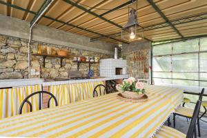 a dining room with a table and a kitchen at Villa Rica by Wonderful Italy in Santa Margherita Ligure