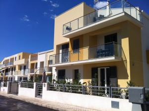 a building with balconies on the side of it at Terra di Sicilia in Avola