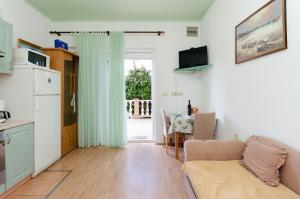 Kuchyň nebo kuchyňský kout v ubytování Apartments Mijatovic