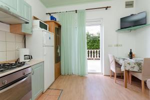 Kuchyň nebo kuchyňský kout v ubytování Apartments Mijatovic