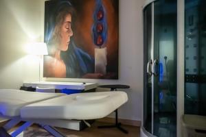 Televízia a/alebo spoločenská miestnosť v ubytovaní Hotel & Spa Villa dei Mosaici