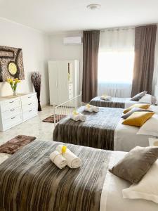 Кровать или кровати в номере Apartment Savoia