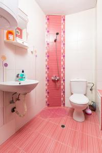 a bathroom with a white toilet and a sink at Lovely 1BD Apartment close to the Summer Theatre by Flat Mаnager in Plovdiv