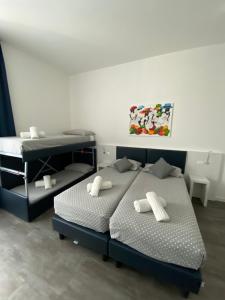 Voodi või voodid majutusasutuse Hotel Aurora & Appartamenti toas