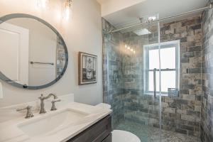 a bathroom with a sink and a mirror at Enjoy Your Stay in this Amazing Location in Philadelphia! home in Philadelphia