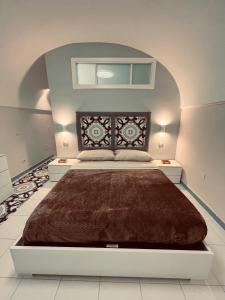 a bedroom with a large bed in a room at Studio loft 85 in Torre Annunziata