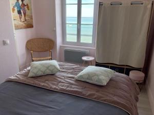 Katil atau katil-katil dalam bilik di Appartement de standing - avec terrasse et vue mer