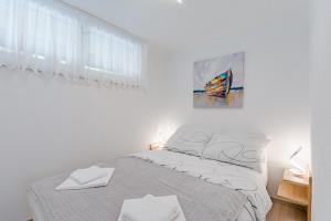 Posteľ alebo postele v izbe v ubytovaní Apartment Eli