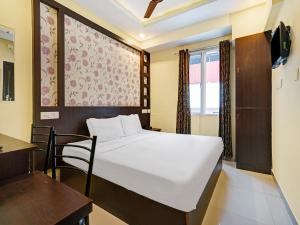 מיטה או מיטות בחדר ב-Galaxy Inn