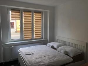 Postel nebo postele na pokoji v ubytování Apartman Kryštof