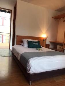 Postel nebo postele na pokoji v ubytování Hotel Abitare 56