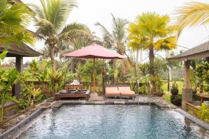 Bazén v ubytování Ananda JJ Ubud Resort & Spa nebo v jeho okolí