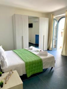 Postel nebo postele na pokoji v ubytování Sperlonga Paradise Suites 500m dal mare in estate Servizio navetta per Sperlonga centro