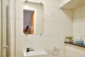 a bathroom with a sink and a mirror at Rooms at 153 ROOM ONLY in Scarborough