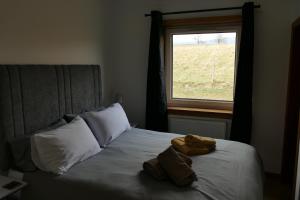 Postel nebo postele na pokoji v ubytování Wallace Lodge