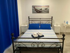 Ένα ή περισσότερα κρεβάτια σε δωμάτιο στο B&B La Perla