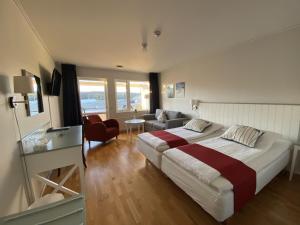 Postel nebo postele na pokoji v ubytování Nordby Hotell