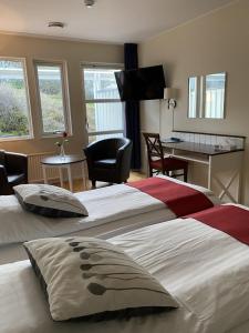 Postel nebo postele na pokoji v ubytování Nordby Hotell